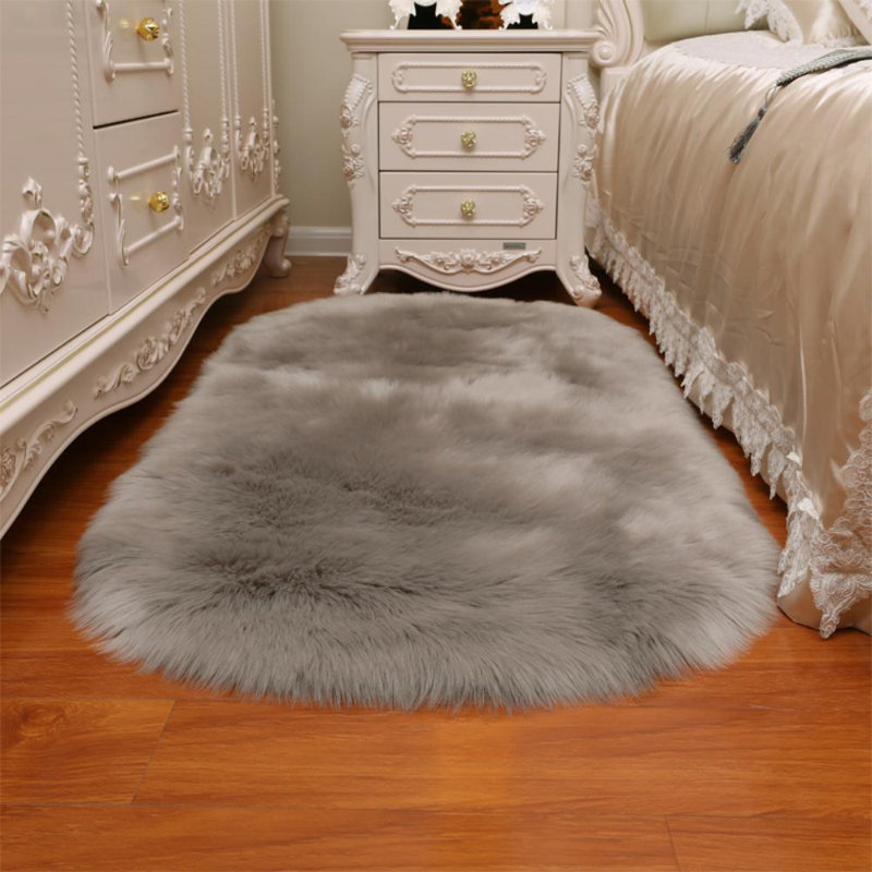 Oval Solid Colour Faux Sheepskin 120cm X 60cm Area Rug