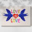 Toile tendue avec châssis «Love Loudly»