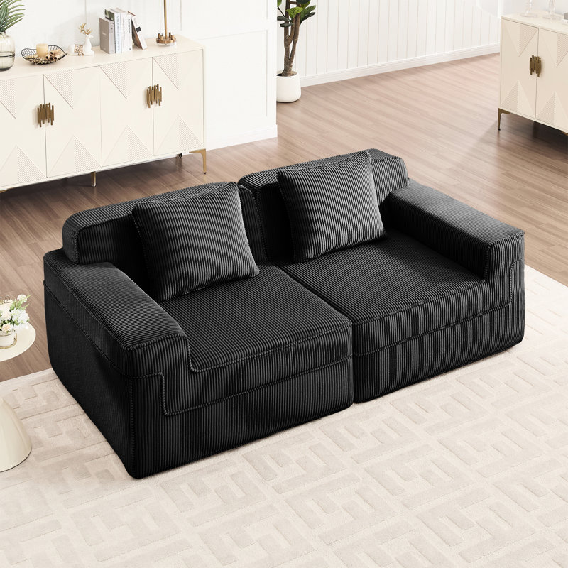 Canapé d'angle modulaire 2 places avec assise profonde, modèle Cloud sans os, en velours côtelé noir, livré monté, confortable et idéal pour les moments en famille, avec coussins amovibles, tissu respirant et base antidérapante.