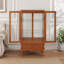 Vitrine lumineuse en verre avec tablettes réglables, deux portes et un tiroir pour la décoration et le rangement, idéale pour mettre en valeur des trésors
