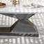 Table basse moderne en pierre frittée avec base en acier inoxydable