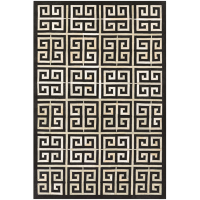 Tapis géométrique noir en cuir de vache Haseeb