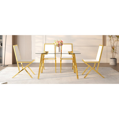 Table And Chair Set.51 × 31.5-Inch Tempered Glass Dining Table, Paired With A Set Of 4 White PU Dining Chairs. Modern Light Luxury Home Restaurant Table And Chair Combination.