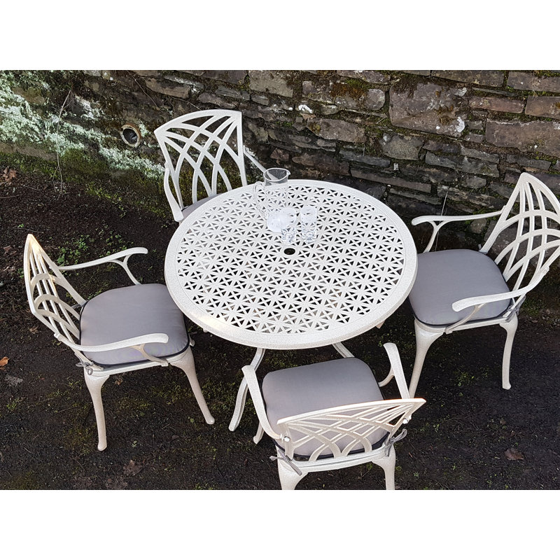 Ryne 4 - Person Patio Dining Set Umbrella Hole Included Round Table with Cushions Included, Sandstone