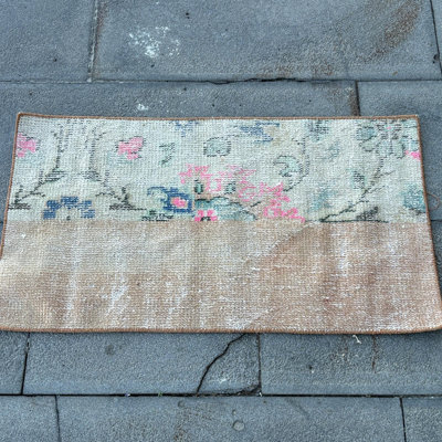 Vintage Turkish Small Rug with Floral Pattern Boasting a Distressed Look for Boho Living Room