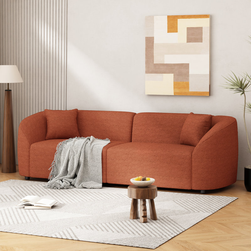 Canapé incurvé contemporain à conception épurée avec structure durable, Boucle orange