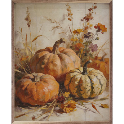 Récolter des citrouilles avec des herbes d'automne