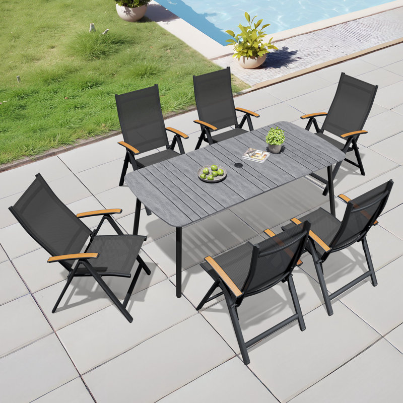 6 - Person 70.9'' L X 33.1'' W Rectangular Patio Dining Set with Umbrella Hole, Aluminum Frame and Folded Reclining Armchairs