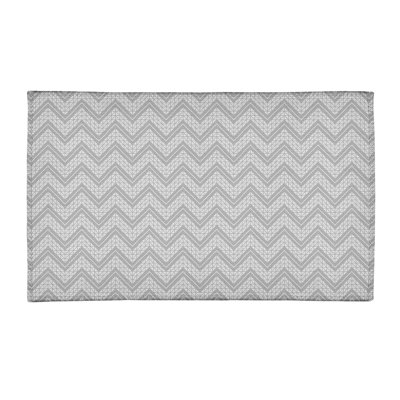 Tapis gris/blanc à chevrons à la main