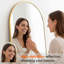 Miroir surdimensionné arqué en métal surdimensionné-570231696-543396702