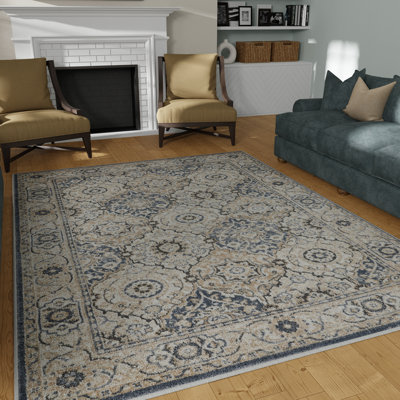Tapis oriental bleu / crème en polypropylène tissé à la machine Aldie