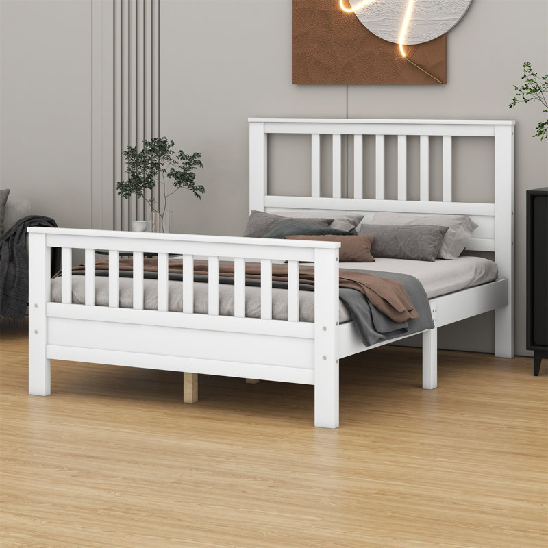 Lit plateforme en bois avec tête et pied de lit