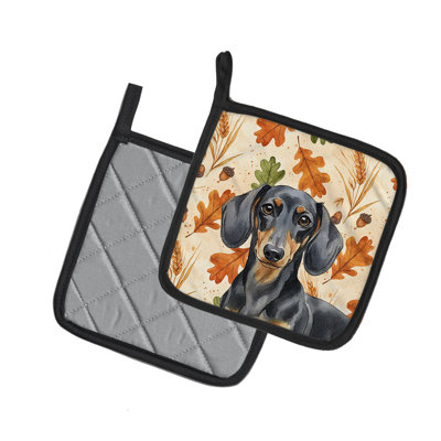 Paire de porte-casseroles en forme de teckel noir et brun clair