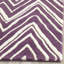 Tapis décoratif ivoire / violet en laine touffeté à la main Sanyla-666458383