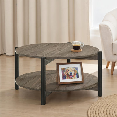 Table basse ronde avec pattes en métal et tablette inférieure ouverte