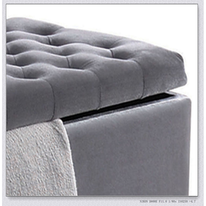 Banc de rangement gris capitonné