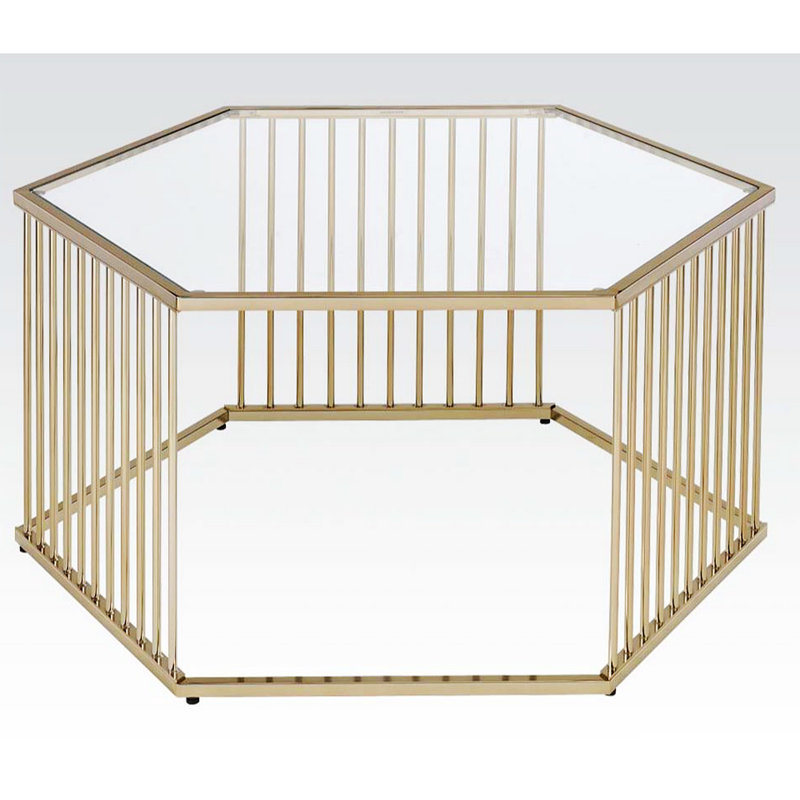 Table basse en champagne et verre transparent
