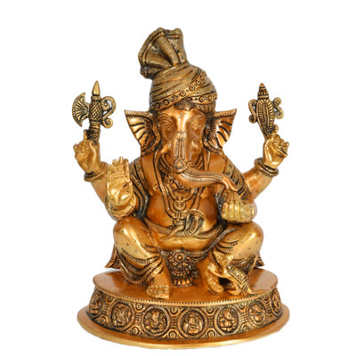 Turbaned Ganesha appréciant Modak