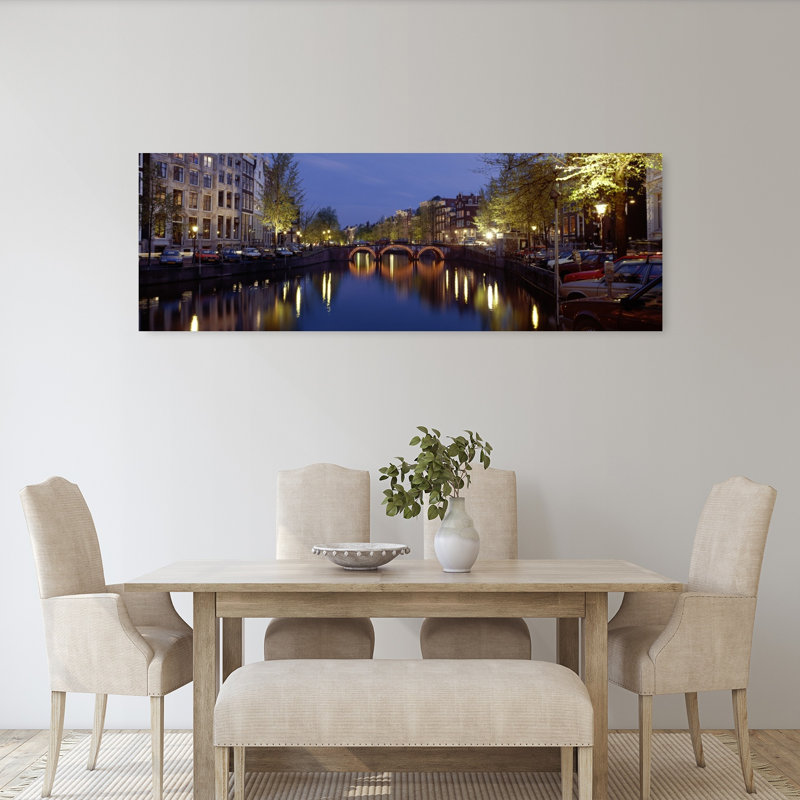 Night View Along Canal Amsterdam The Netherlands by Collezione Panoramica - Wrapped Canvas Panoramic Print