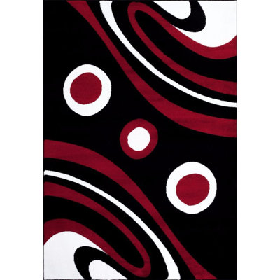 Tapis noir / rouge à motif abstrait