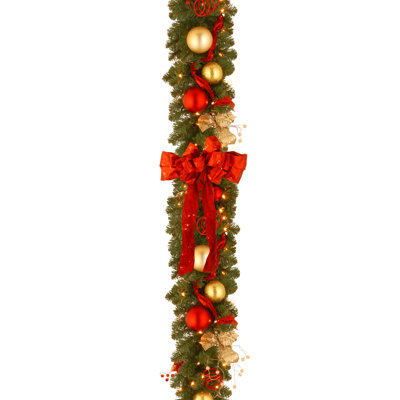 9 ft. Decorative Collection Cozy Christmas Garland with Red and Clear Lights