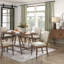 Table de salle à manger Design Pc et chaises en X rembourrées en tissu Backwooden