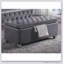 Banc de rangement gris capitonné