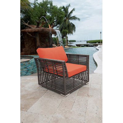 Chaise longue d'extérieur en osier graphite avec coussins