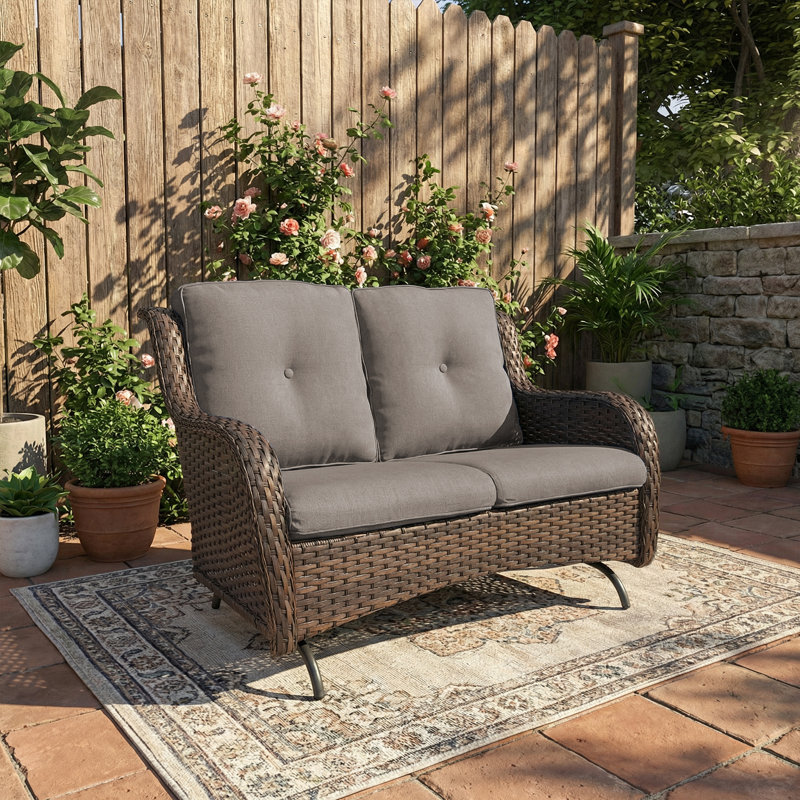 Causeuse de patio berçante Mickala avec structure robuste et sièges coussins, Brun, Gris
