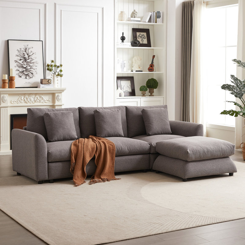 2,2 pouces modulaire pour appartement - canapé-lit en forme de L gris avec trois coussins, salon avec coussins
