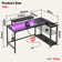 Baford L-shaped Computer Desk with Power Outlet, Gaming Desk with Monitor Stand and Shelves