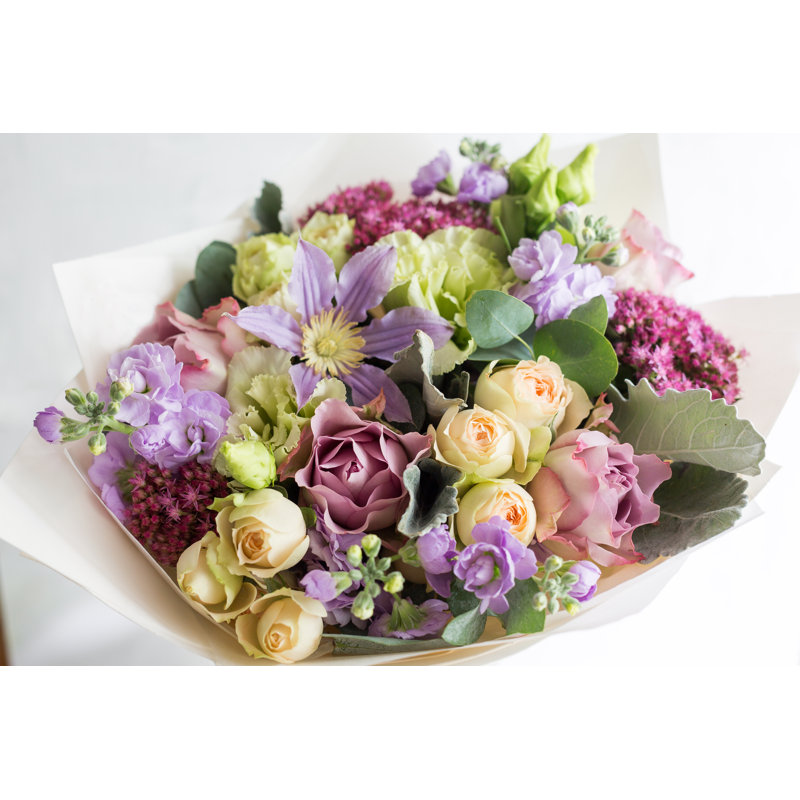 Close-up Floral Composition With Roses And Mix Flowers On A Light Background by Malkovstock - Wrapped Canvas Print