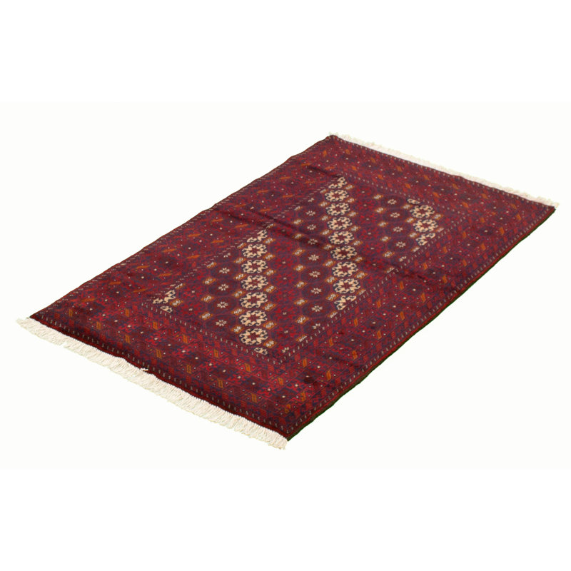 Tapis rouge foncé en laine noué à la main