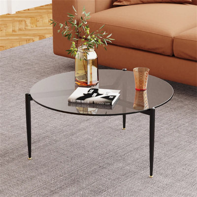 Table basse grise simple à trépied ronde, verre trempé / finition noire