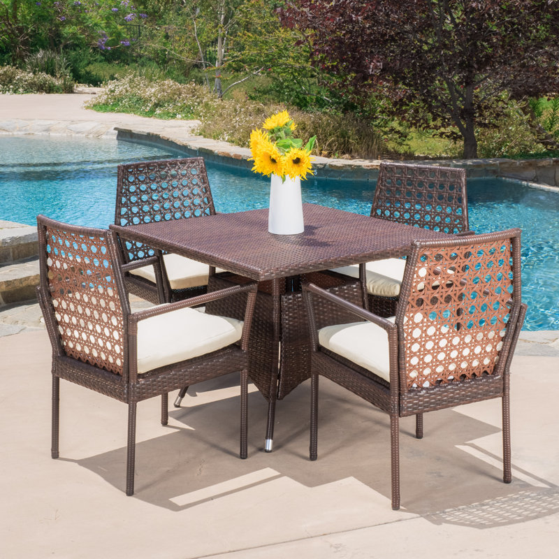 Marrero 4 - Person Wicker Patio Dining Set with Square Table , Cushions Included