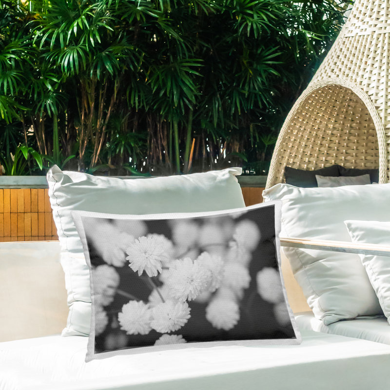 White Dahlias on Black Outdoor Printed Pillow design by ANNA COPPEL