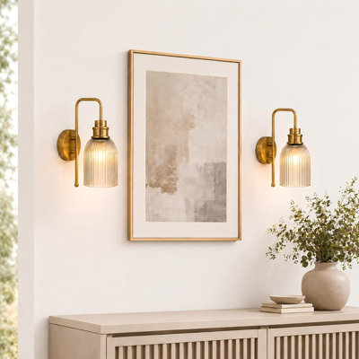 Brushed Gold Wall Sconces with Vertical Ribbed Amber Glass shade
