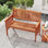 Banc de jardin extérieur en bois avec accoudoirs à dossier et siège à lattes pour véranda