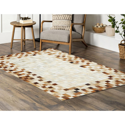 Tapis en peau de vache beige clair