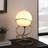 Table Lamp, White Glass Globe, 4 Spiral Ring Accented Base 14 Inch