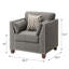 Fauteuil à accoudoirs évasés gris anthracite clair avec coussins décoratifs, alliant confort et style pour tout espace de vie