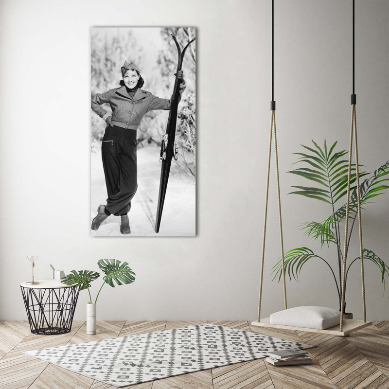 Woman With Skis - Wrapped Canvas Print