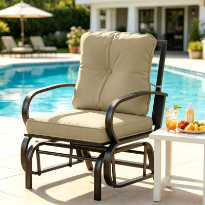 Fauteuil à bascule de jardin confortable avec glissement en douceur, cadre en acier galvanisé durable et coussins résistants à l'eau pour une détente en plein air.