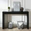 Console moderne noire avec motif nervuré