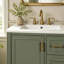 Meuble-lavabo moderne de 24 po avec lavabo en céramique, porte à fermeture douce, 3 tiroirs, poignées dorées et support de porte pour un rangement peu encombrant-229269728