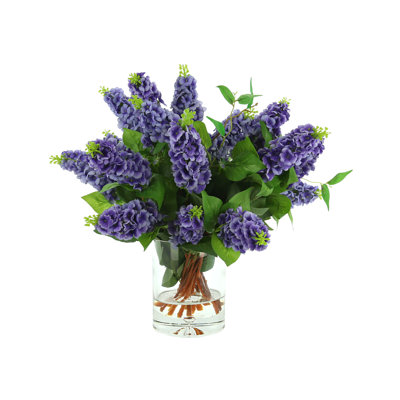 Italian Lilac Floral Arrangement In A Cylindrical Glass Vase