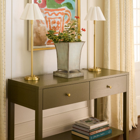 Entryway table with lamps and potted plant