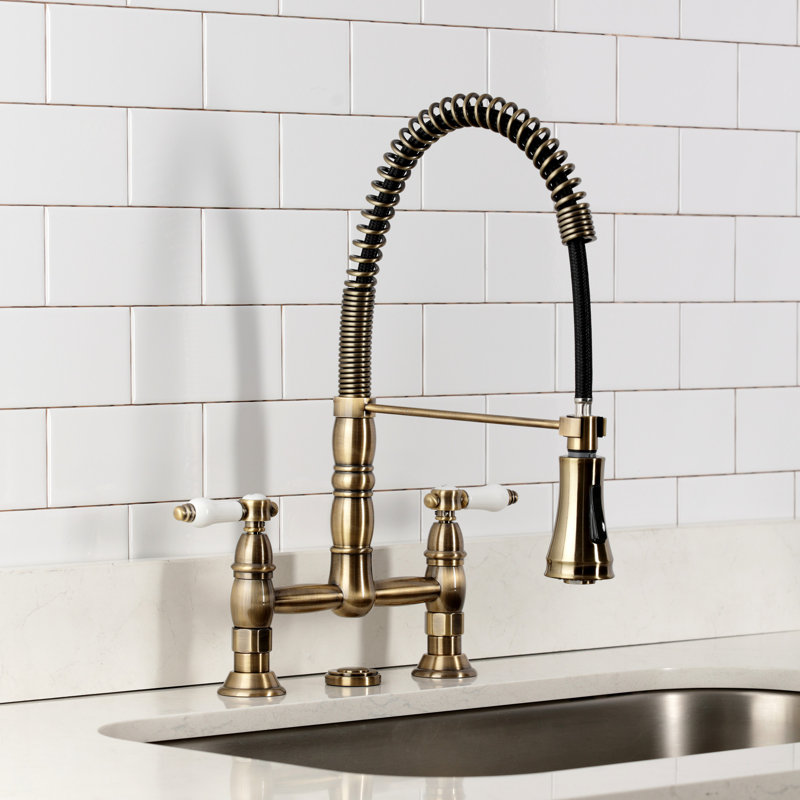 Kingston Brass Bel-Air Double-Handle 2-Hole Deck-Mount Pre-Rinse Bridge Kitchen Faucet, Antique Brass