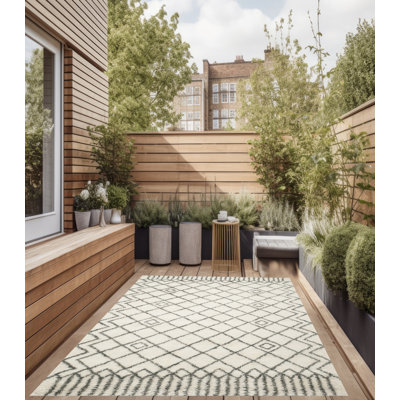 Addelynn Geometric Vinyl Machine Printed Area Rug