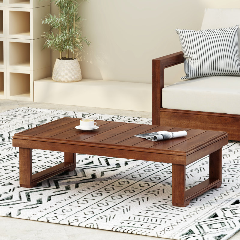 Table basse rustique en bois pour l'extérieur, plateau à lattes et pieds traîneaux, couleur [couleur manquante], profondeur du plateau : 95 cm, teinte foncée, hauteur : 29 cm